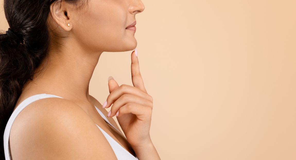 Facial Implant Patient side closeup woman touching chin