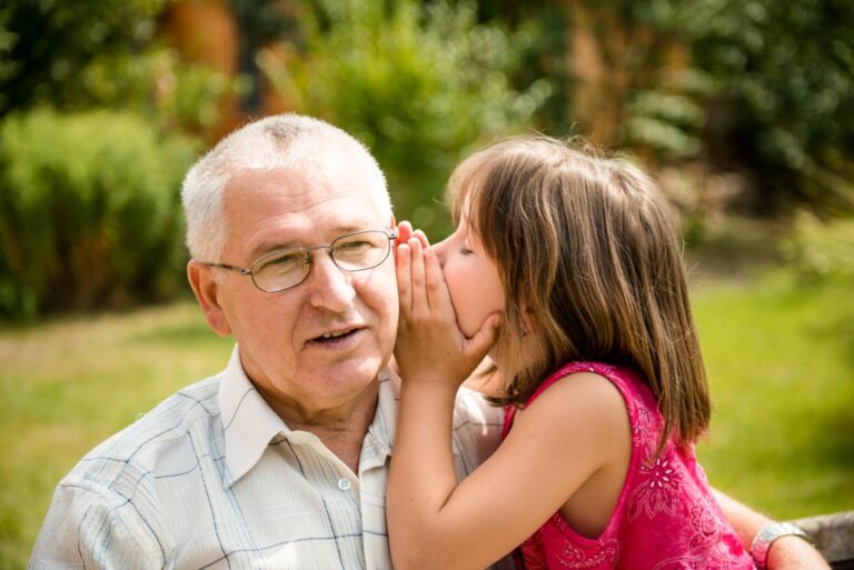 Otosclerosis-symptoms child whispering to grandfather